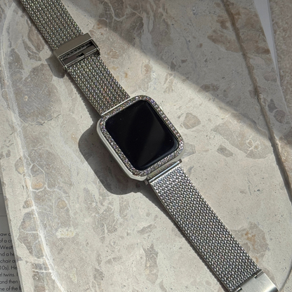 apple watch with a silver rhinestone apple watch band on a marble plate