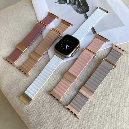 Blush, nude, white, pink and light grey ribbed vegan leather Apple Watch bands laid out on linen. Magnetic iWatch straps in a soft neutral palette, compatible with Apple Watch 38mm to 49mm, Series 1-11, SE and Ultra