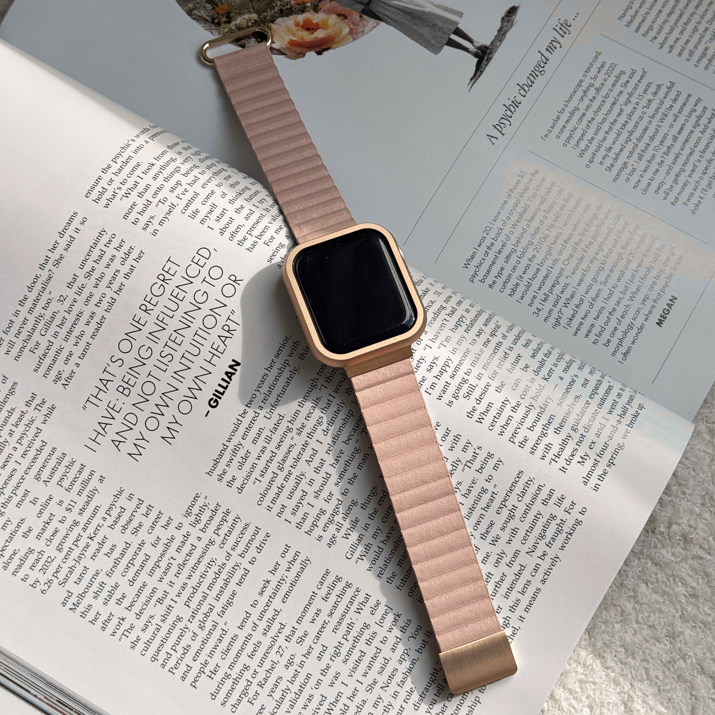 Rose gold stainless steel Apple Watch case cover shown on an open magazine with a nude band. Durable protective bumper, available for Apple Watch 38mm to 49mm, Series 1-11, SE and Ultra