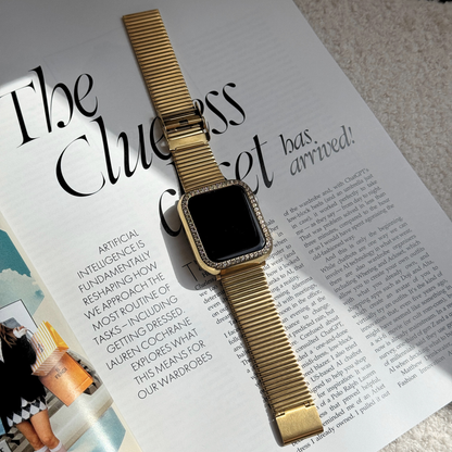 gold apple watch band with a Gold rhinestone apple watch case on a stylish journal/magazine