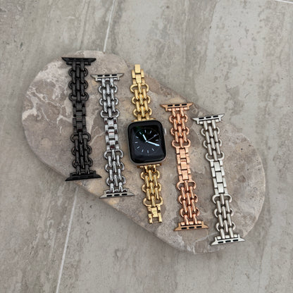Black, silver, gold, rose gold and starlight chain link Apple Watch bands laid out on a stone tray. Sleek metal iWatch straps and bracelets, compatible with Apple Watch 38mm to 49mm, Series 1-11, SE and Ultra