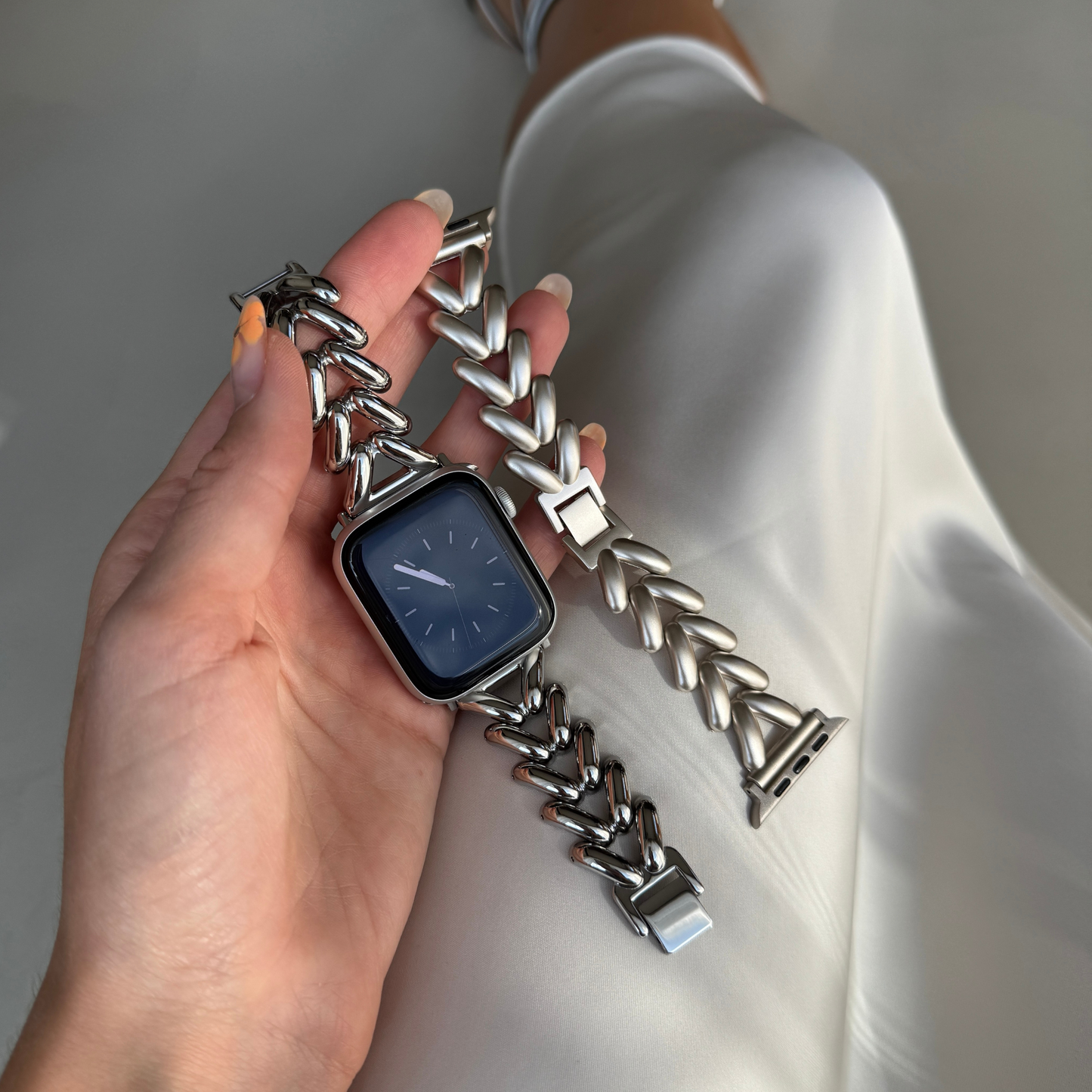 Silver chunky chain Apple Watch band shown beside a matching chevron link starlight band. Metal iWatch straps with a beautiful shine, compatible with Apple Watch 38mm to 49mm, Series 1-11, SE and Ultra