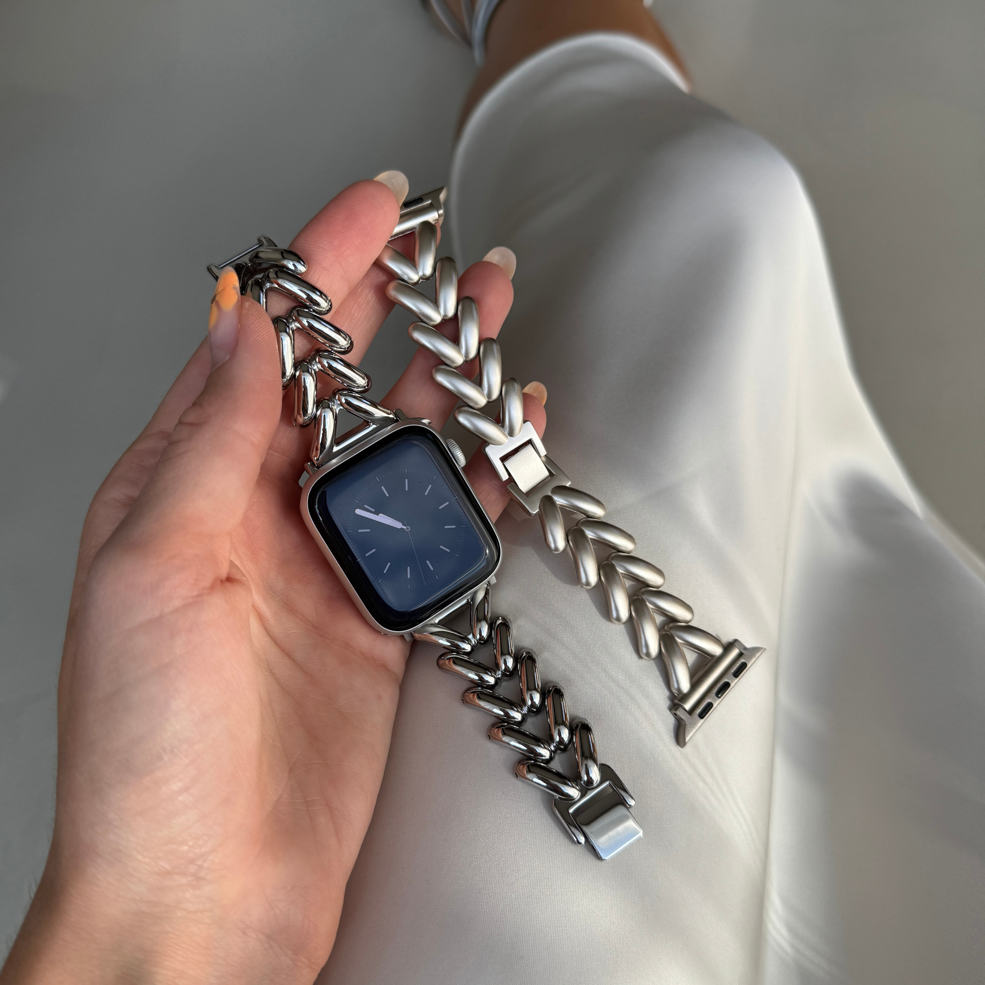 Silver chunky chain Apple Watch band shown beside a matching chevron link starlight band. Metal iWatch straps with a beautiful shine, compatible with Apple Watch 38mm to 49mm, Series 1-11, SE and Ultra