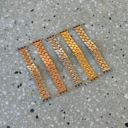 Silver, rose gold, gold, silver rose gold and silver gold pebble link Apple Watch bands laid out on terrazzo. Slim stainless steel iWatch straps, compatible with Apple Watch 38mm to 49mm, Series 1-11, SE and Ultra