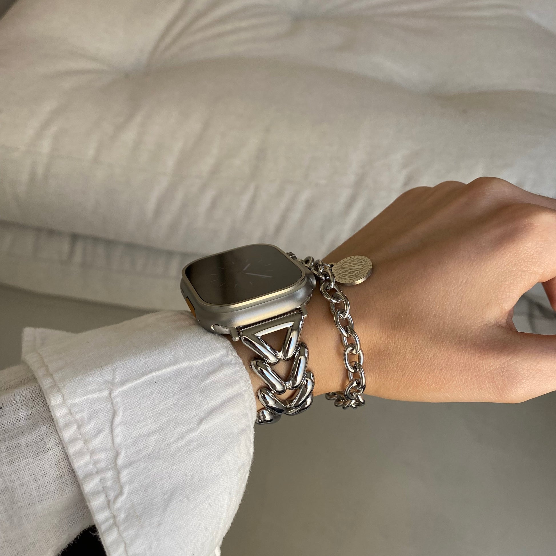 Silver braided link Apple Watch band worn with a matching chain bracelet. Unique metal iWatch bracelet gift, compatible with Apple Watch 38mm to 49mm, Series 1-11, SE and Ultra